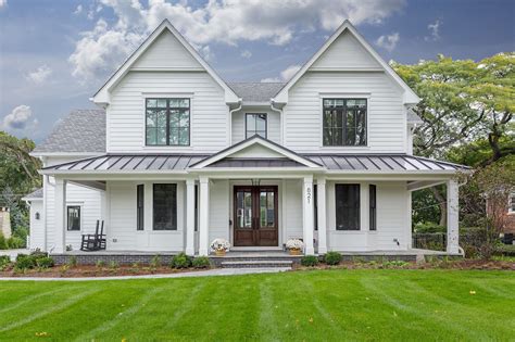 vlack metal roof with white house|black metal roof house pictures.